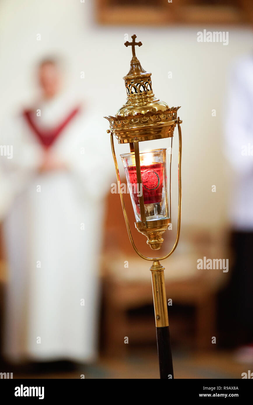 Sacred candle holder at a catholic church service Stock Photo Alamy
