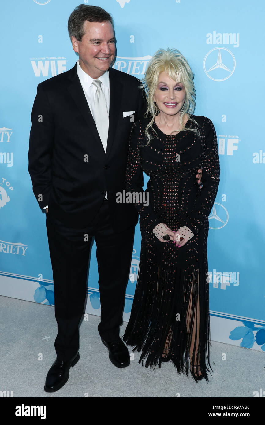 WEST HOLLYWOOD, LOS ANGELES, CA, USA - SEPTEMBER 15: Sam Haskell, Dolly  Parton arrive at the Variety And Women In Film Annual Pre Emmy Awards  Celebration 2017 held at Gracias Madre on