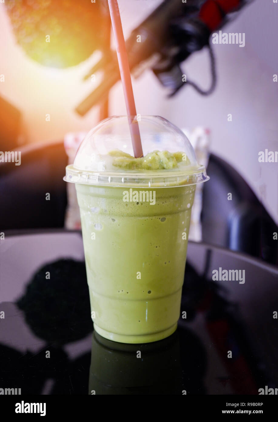 Milk froth green tea smoothie / Iced green tea in plastic cup smoothie