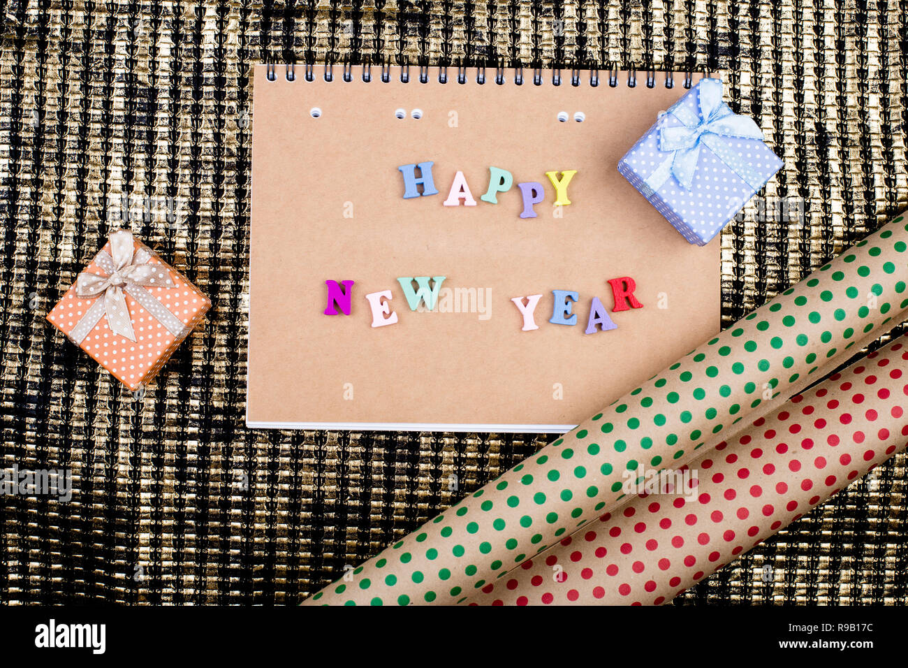 Notepad of kraft paper on a golden background with the inscription ...