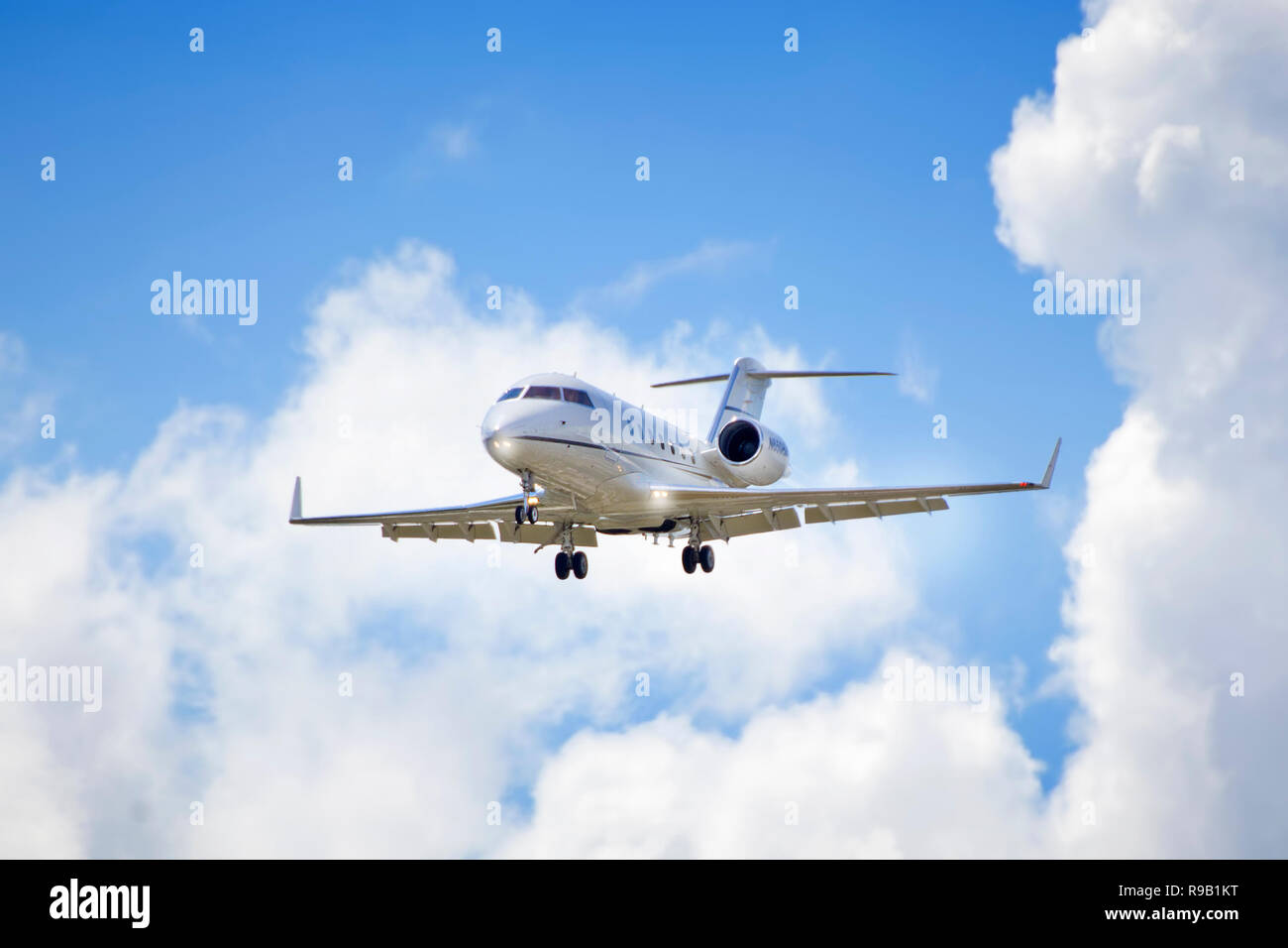 A private jet on it's final approach to Palm Beach International Airport. Stock Photo