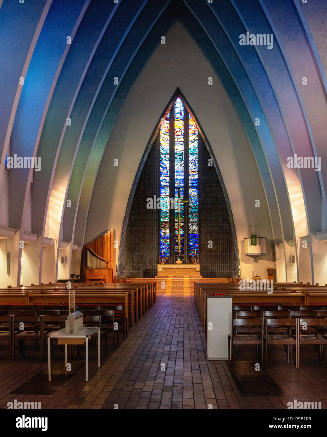 Berlin, Wilmersdorf, Kirche am Hohenzollernplatz Evangelical church interior with 13 steep neo-Gothic arches,stained glass windows Stock Photo