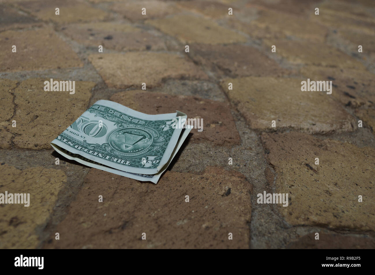 Finding Money On The Floor Stock Photo