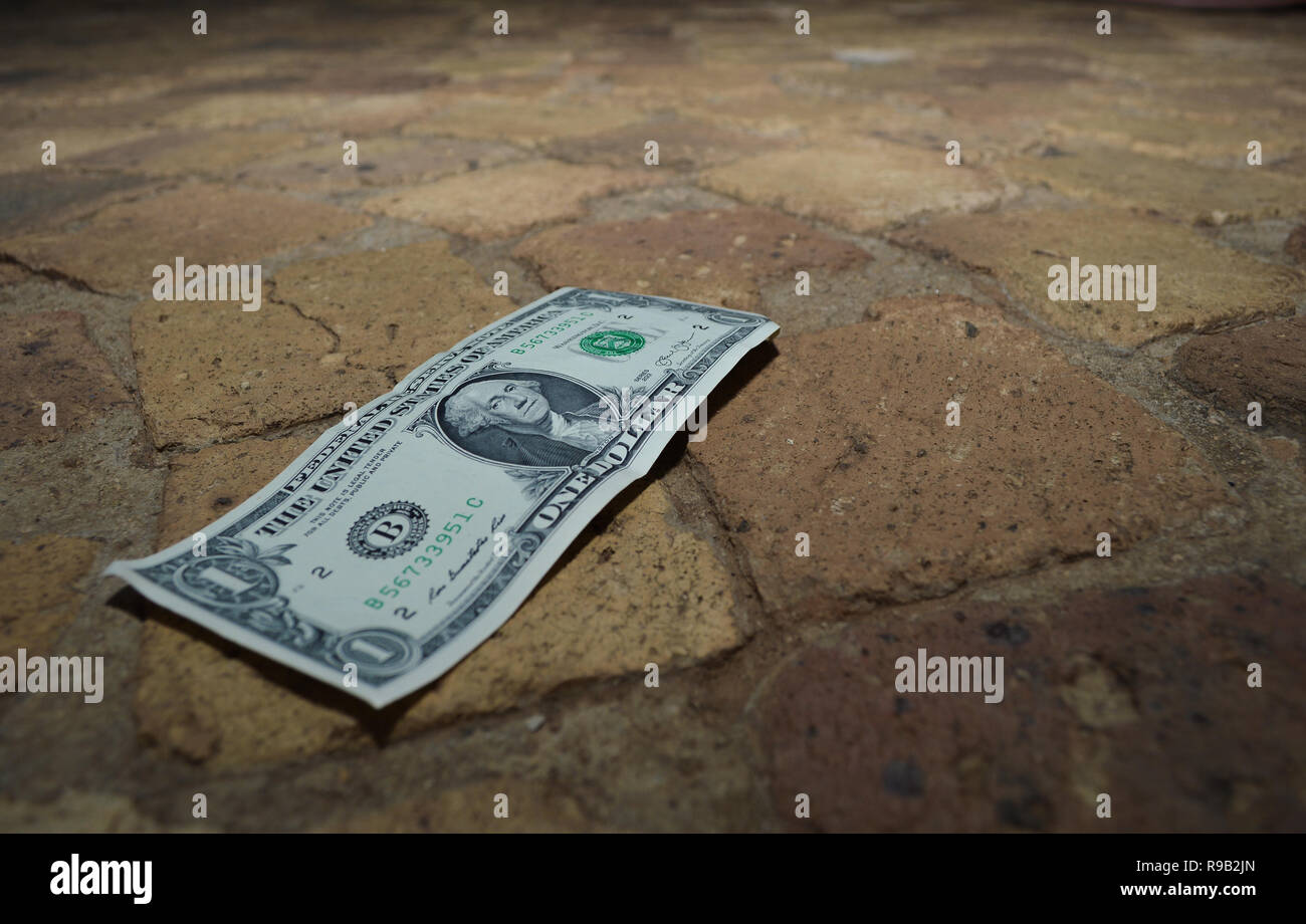 Finding Money On The Floor Stock Photo