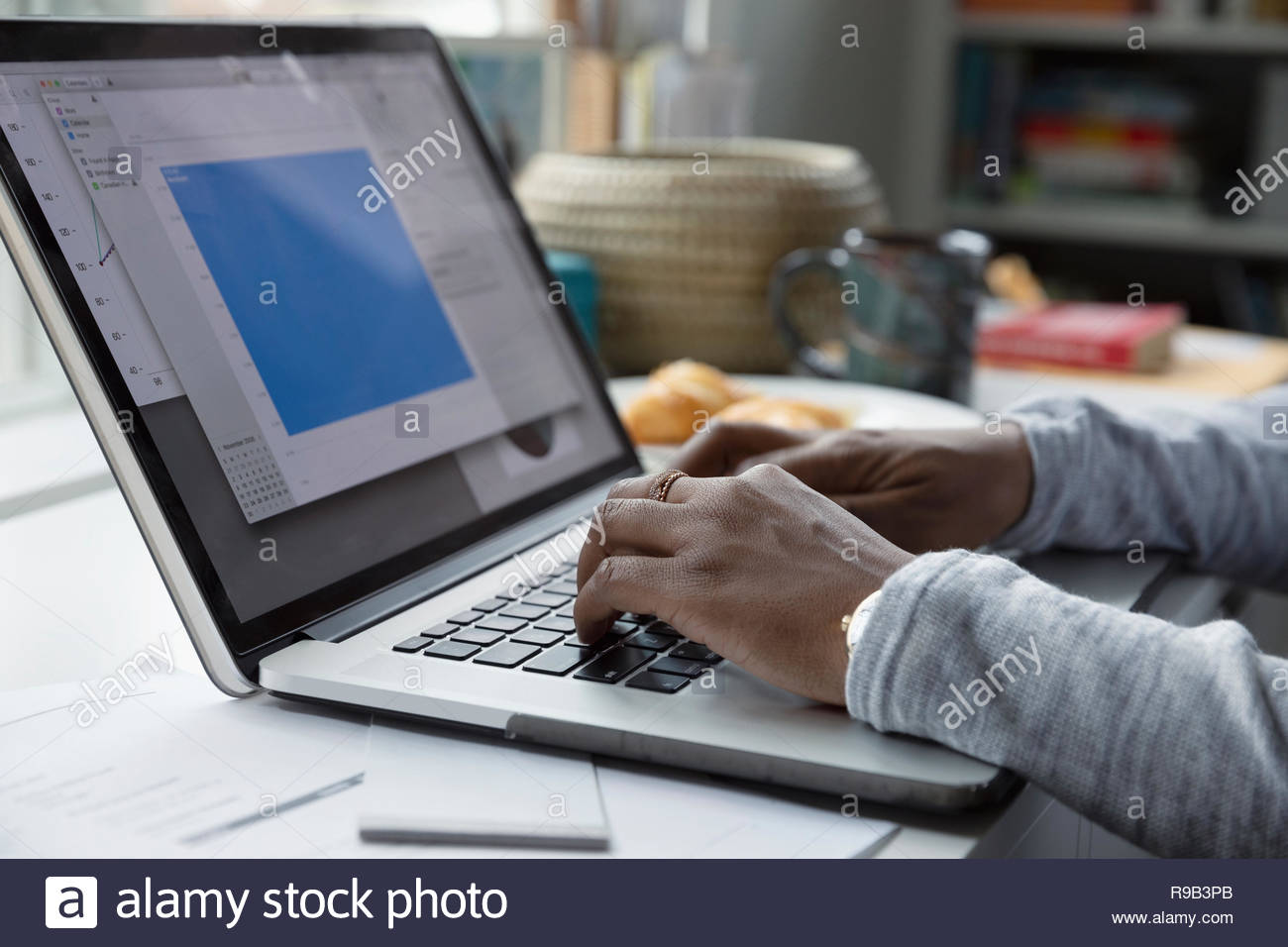Close up woman working at laptop Stock Photo
