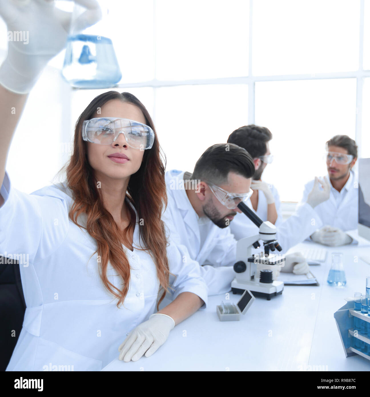 group of young scientists working in the laboratory Stock Photo - Alamy