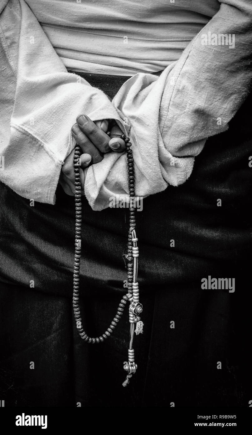 Prayer beads in hand hi-res stock photography and images - Alamy