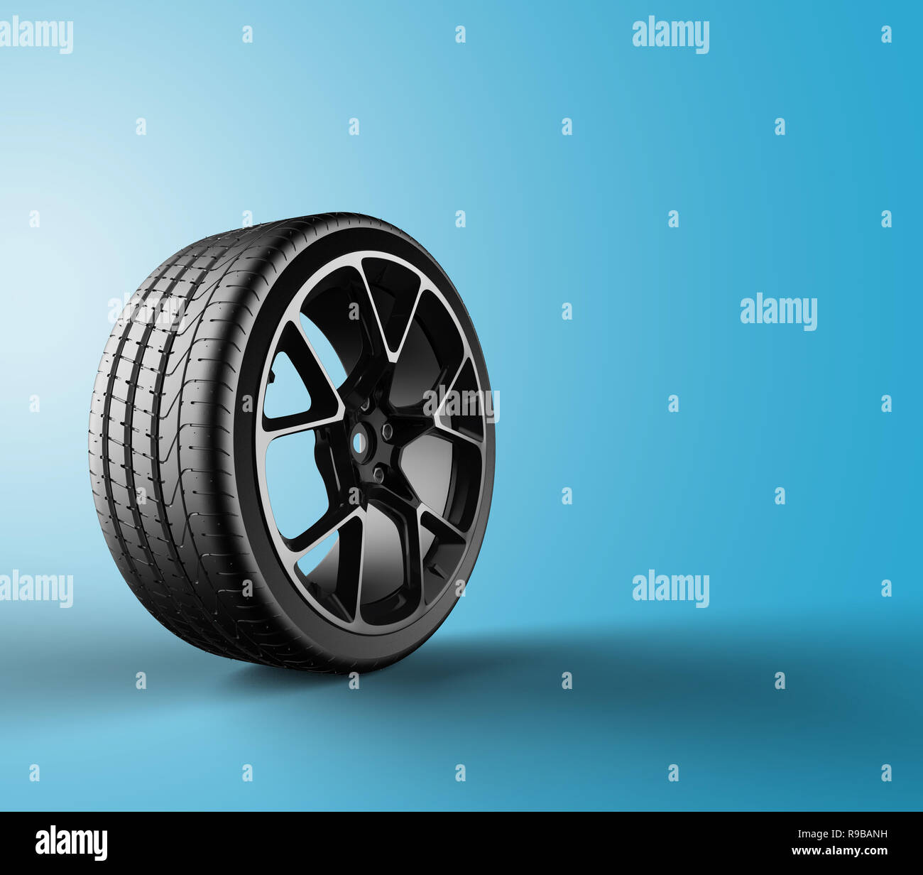 Car wheel isolated on a blue background, 3d illustration Stock Photo ...