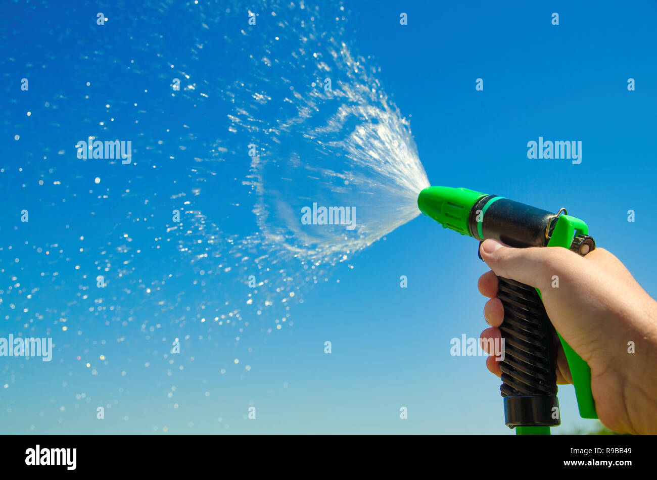 Hand holding water splash hires stock photography and images Alamy