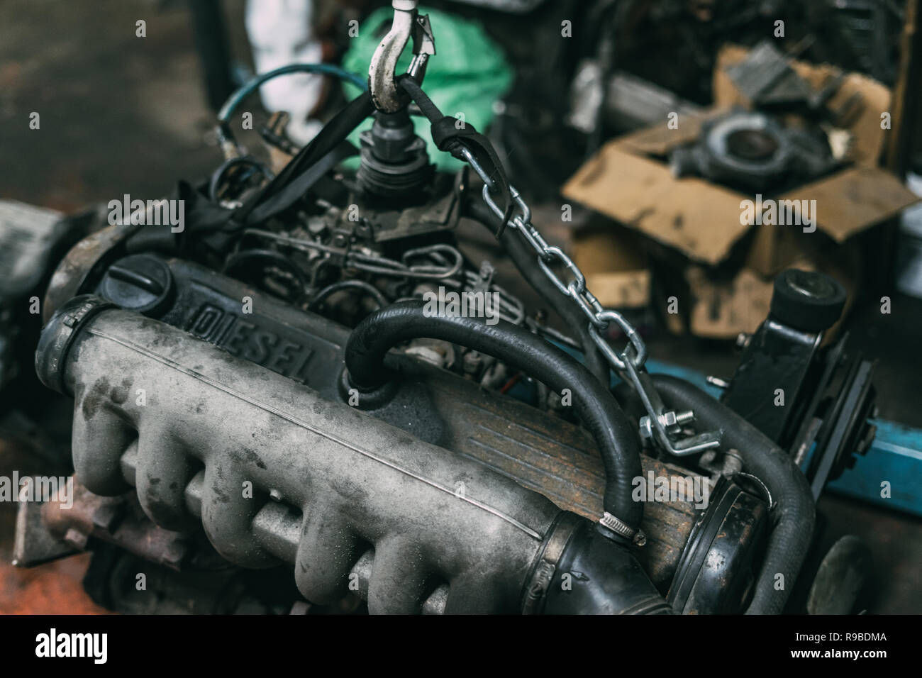 Engine instalation on crane hook on car repair service Stock Photo