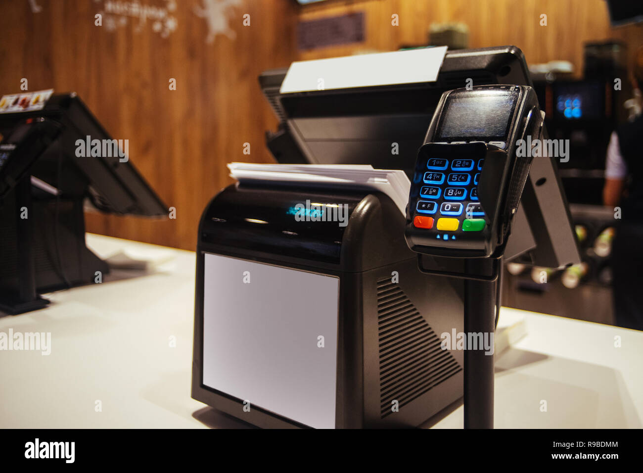 Poin of sell terminal with touchless technology and cashbox on background Stock Photo