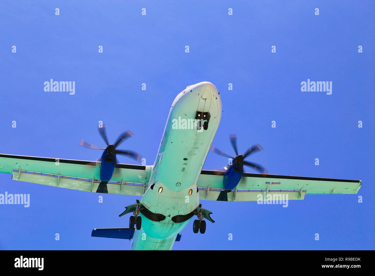 Plane landing in the famous Sint Maarten airport with a short landing strip Stock Photo