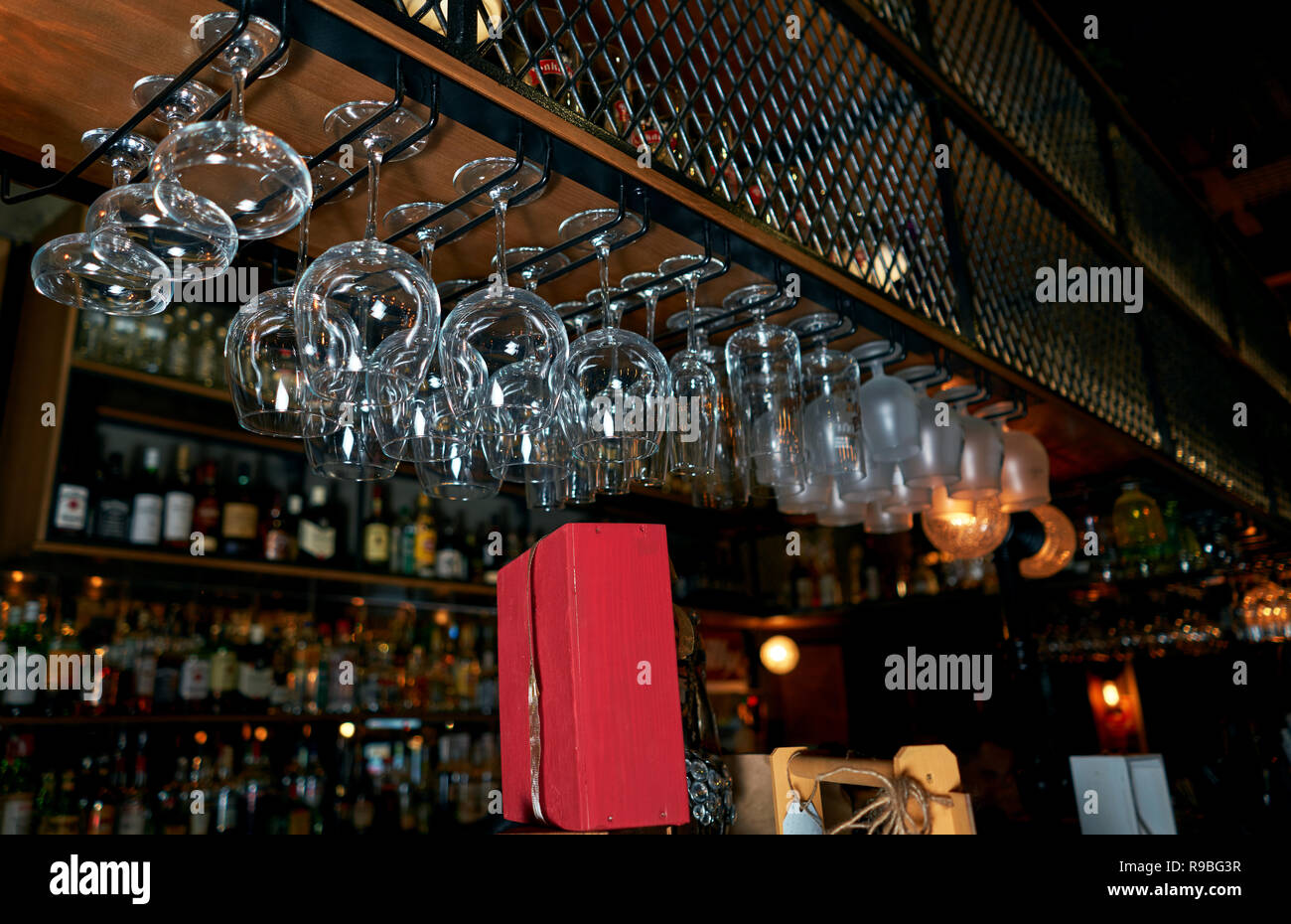 glasses hanging over the bar Stock Photo Alamy