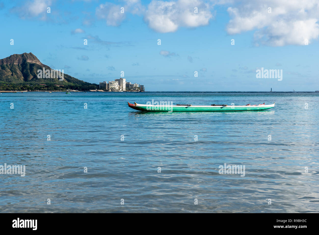 Double canoe in the water on Waikiki Beach in Honolulu, Hawaii with Diamond Head in the