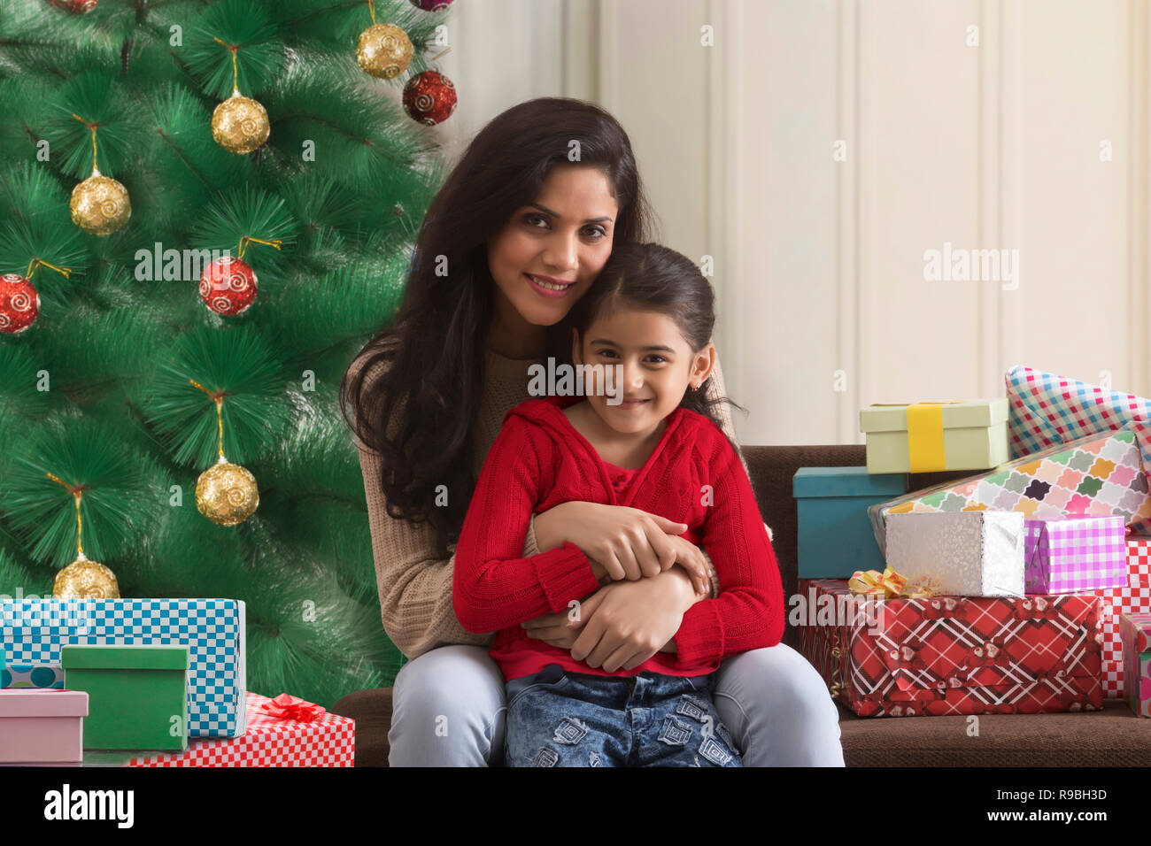 Mother and daughter with Christmas gifts Stock Photo