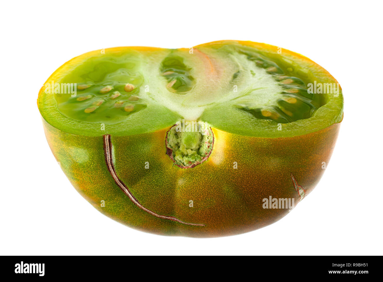 Green ripe tomatoes "Magic Glow" isolated on white Stock Photo - Alamy