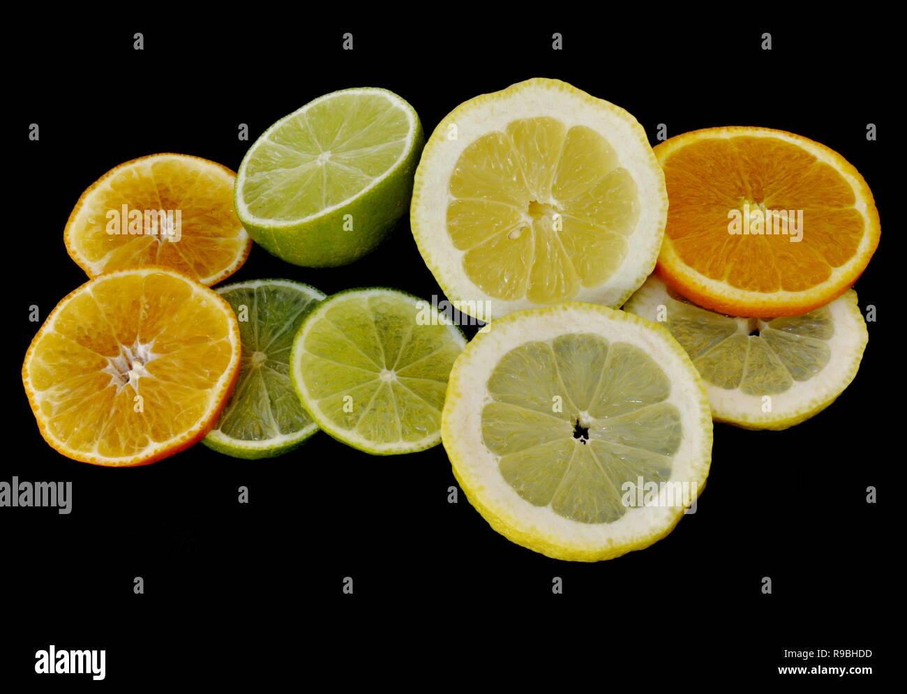 Different citrus fruits on black background Stock Photo Alamy