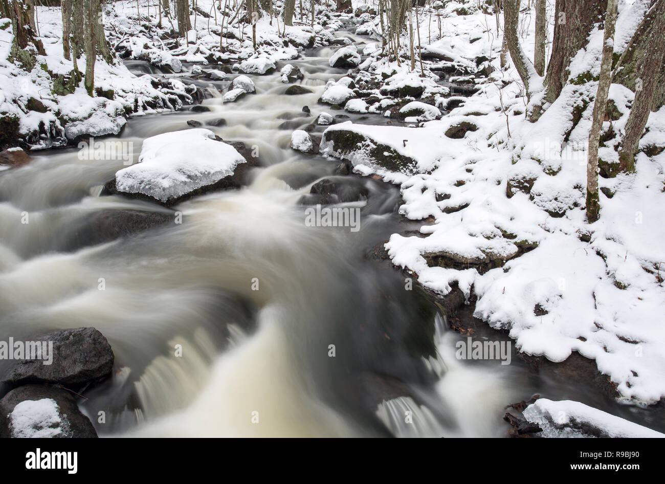 Flowing river in mid-winter, Espoonkartano, Espoo, Finland Stock Photo