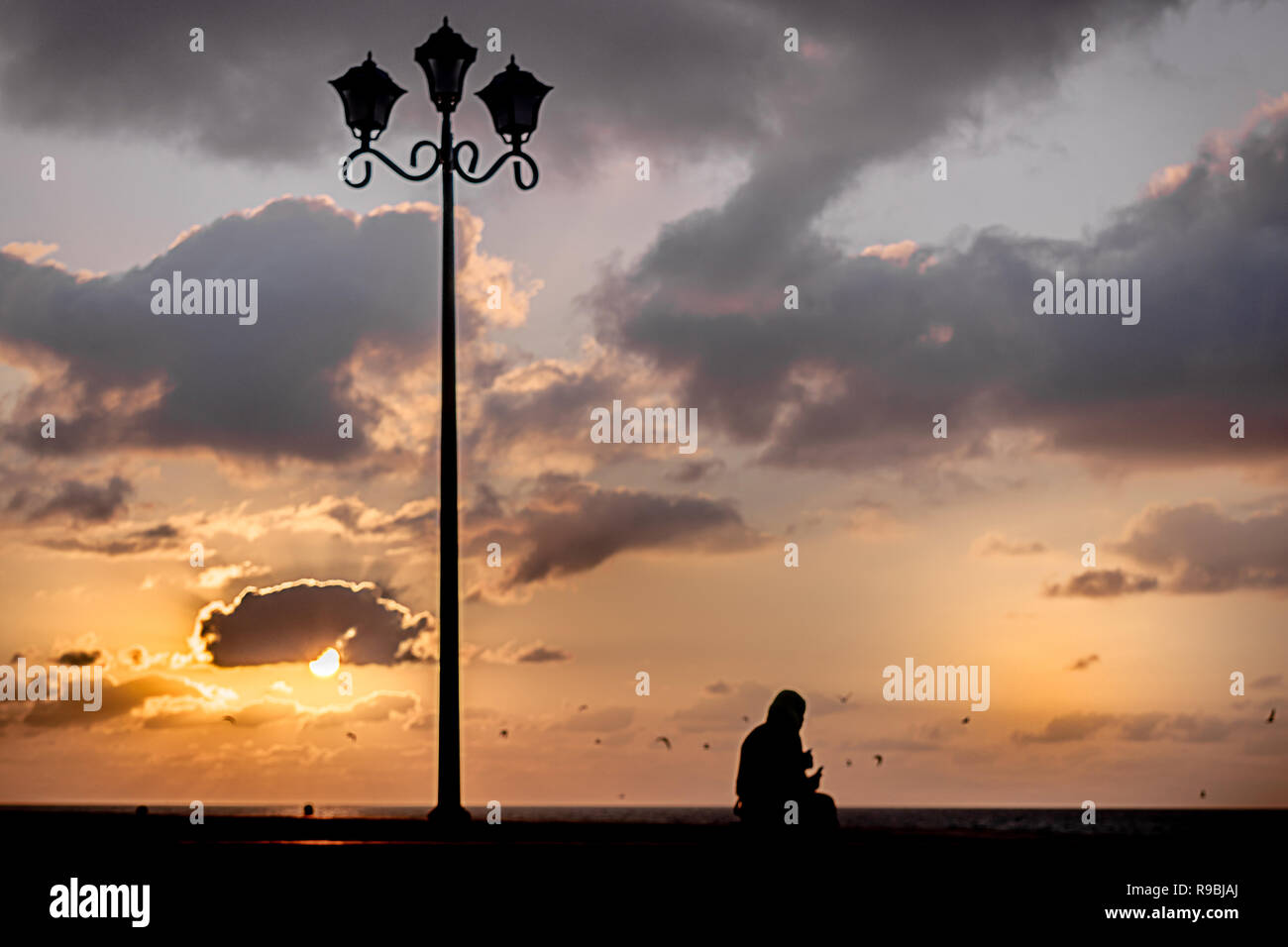 Loneliness Silhouette conceptual shot ,sunset and shadows Stock Photo