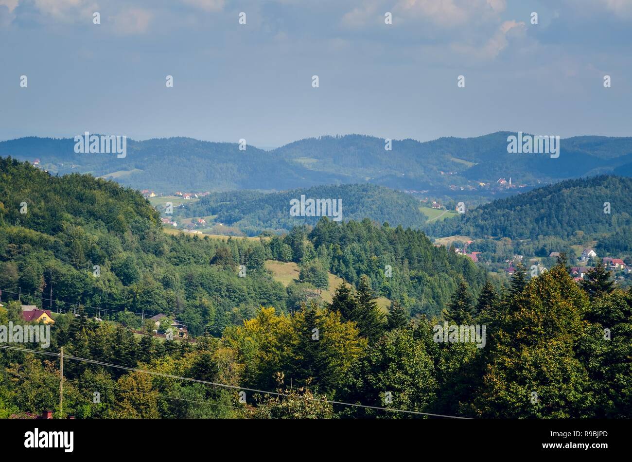 Pretty Rural View Beautiful rural mountain landscape. Cottages on the hills in the summer ...