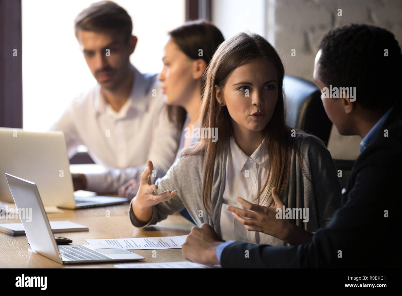 Focused diverse male female colleague hi-res stock photography and ...