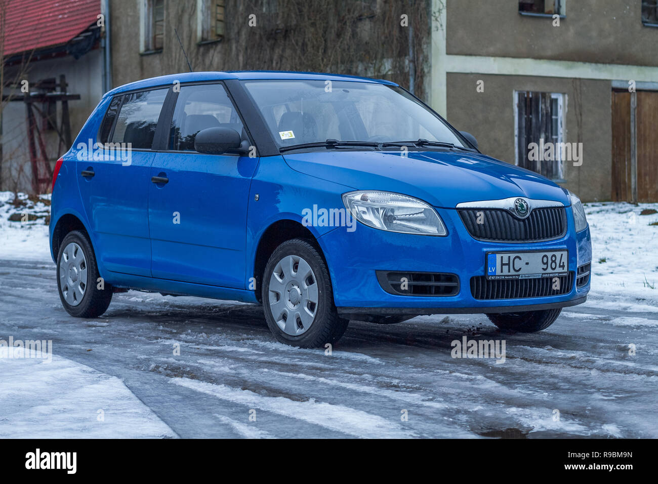 City Cesis, Latvia. Blu Skoda Fabia to street, trees an way. Winter, travel  photo 2012 Stock Photo - Alamy