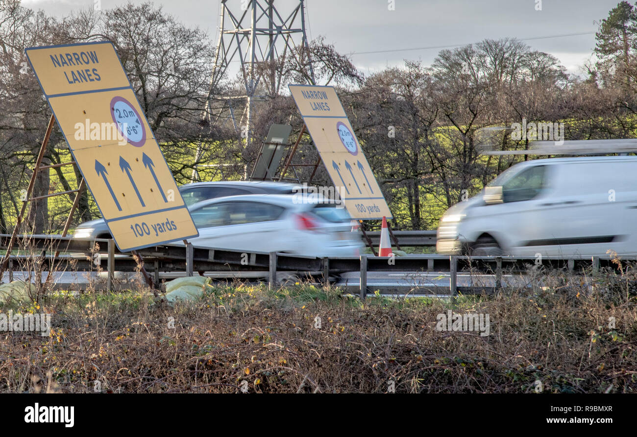 A car and van enter an average speed check area on the motorway due to narrow lanes and smart motorway upgrade Stock Photo