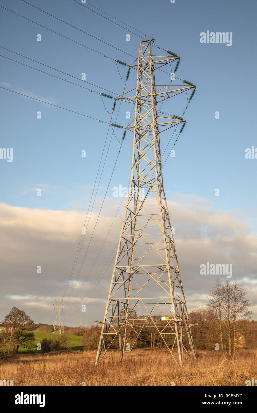 Overhead line power cables and pylons for electrical energy transmission and distribution 11kV, 33kV, 132kV, 275kV, 400kV and HVDC Stock Photo