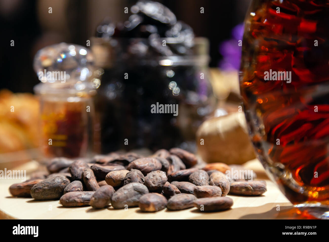 Closeup luxury cognac or brandy in crystal round bottle with nuts