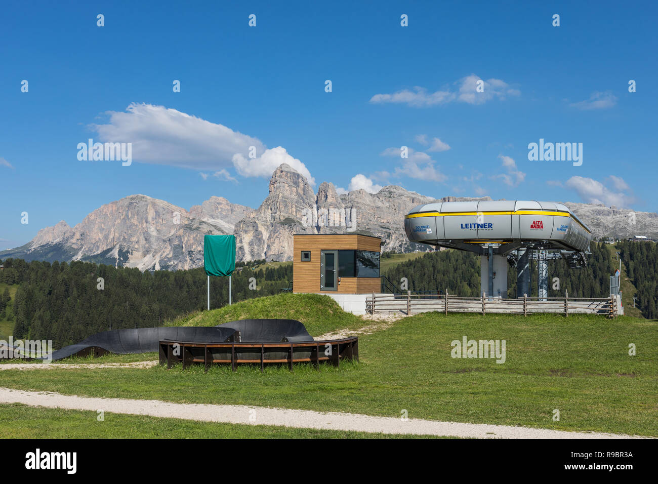 Upper ski lift or chairlift station in summer, Alta Badia ski resort in summer, Dolomites, Italy Stock Photo