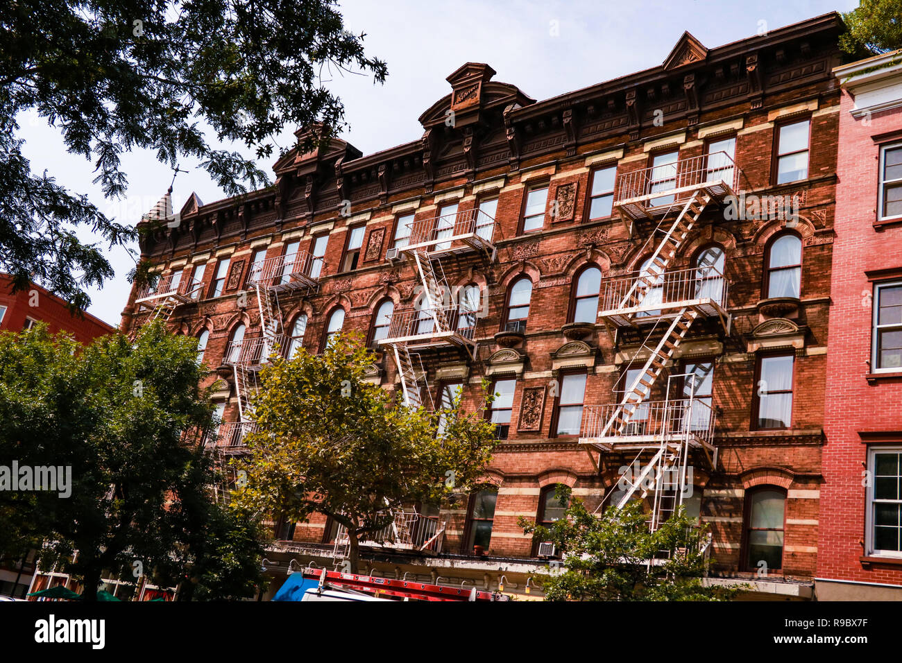 Wall of the house with fire stairs in downtown New York Stock Photo
