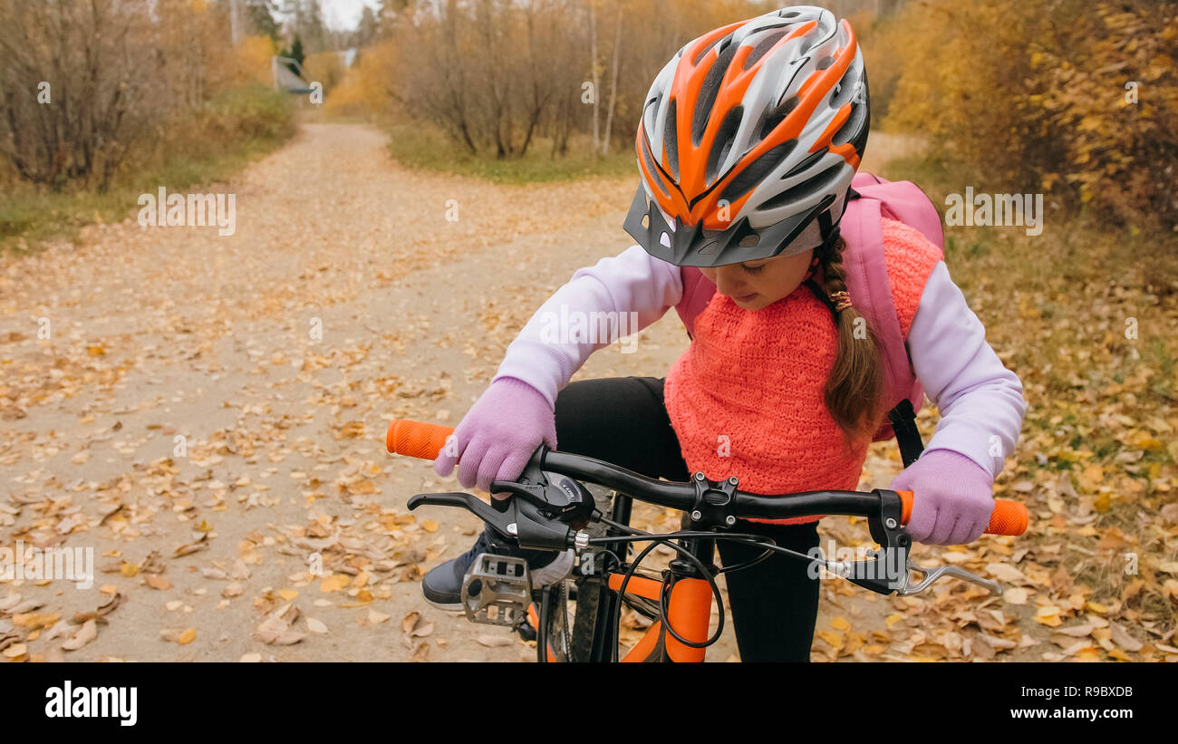 black and orange bike helmet