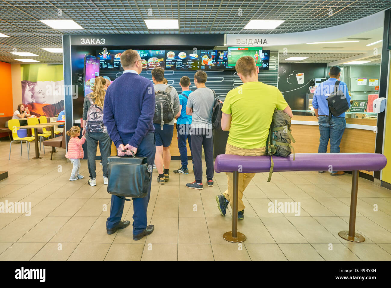 SAINT PETERSBURG, RUSSIA - CIRCA MAY, 2018: people at McDonald's restaurant in Pulkovo airport. Stock Photo