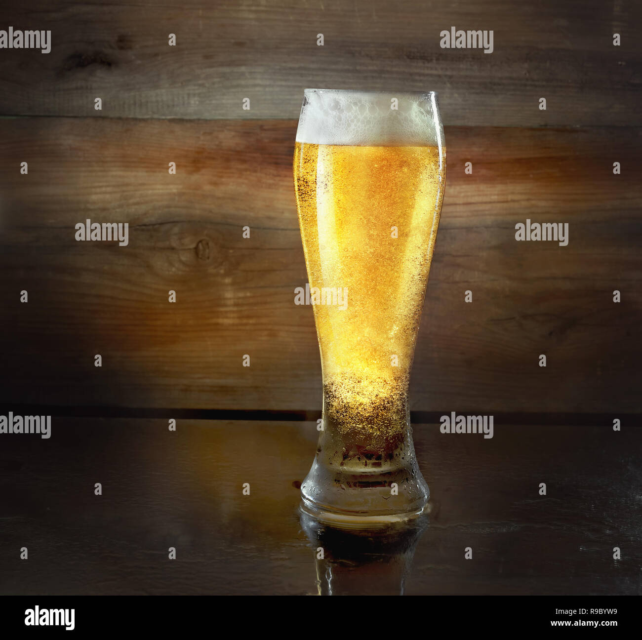 Beer glass on old wooden background Stock Photo