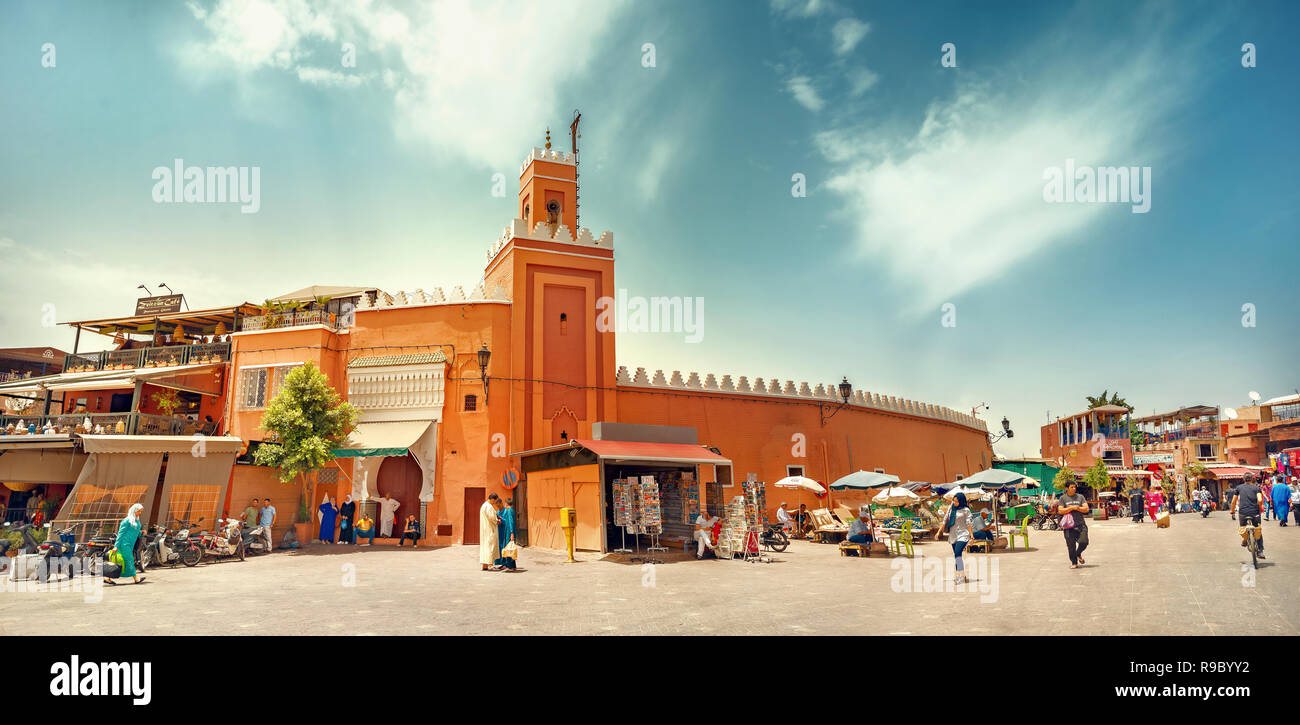 Market square Djemaa el Fna with mosque and minaret at Marrakesh's Medina quarter. Marrakesh, Morocco, North Africa Stock Photo
