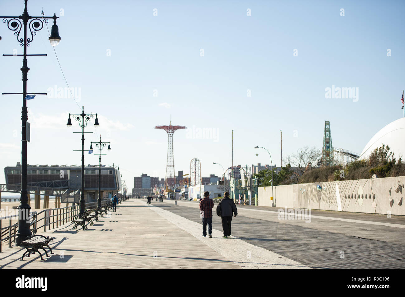 Some people are walking on the seafront of coney island. United States. Stock Photo