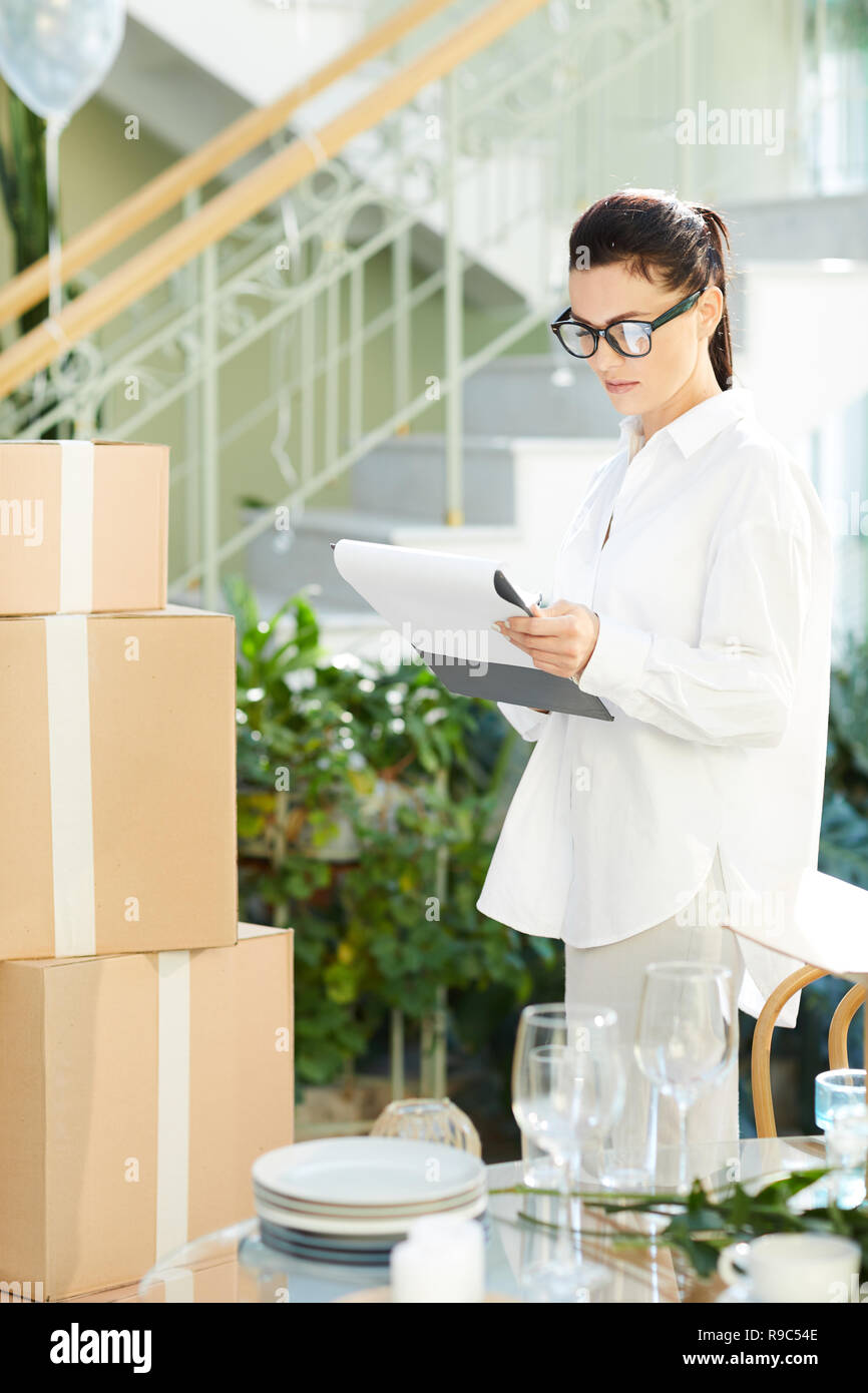 Busy restaurant manager controlling delivery Stock Photo