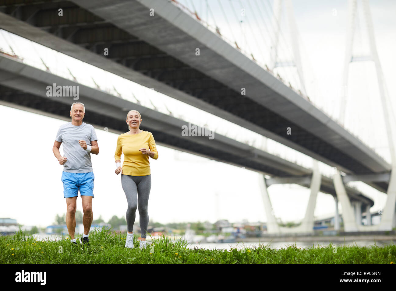 Running on grass Stock Photo - Alamy