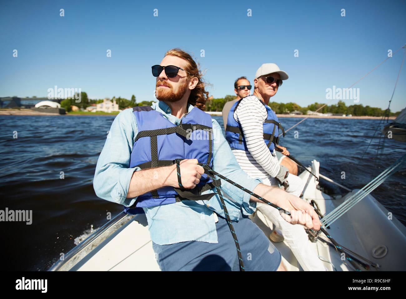 Men on yacht Stock Photo