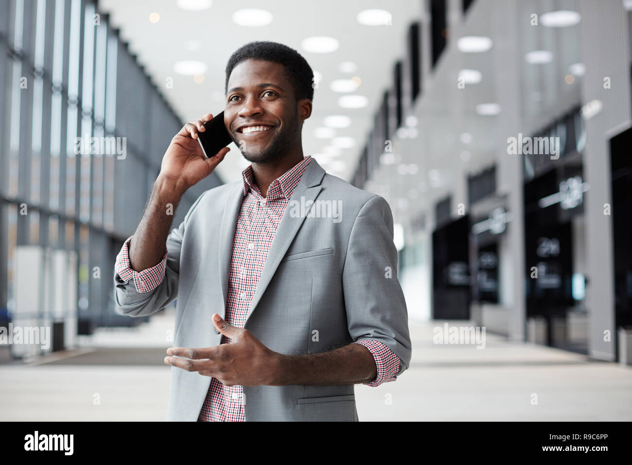 Phoning in lounge Stock Photo