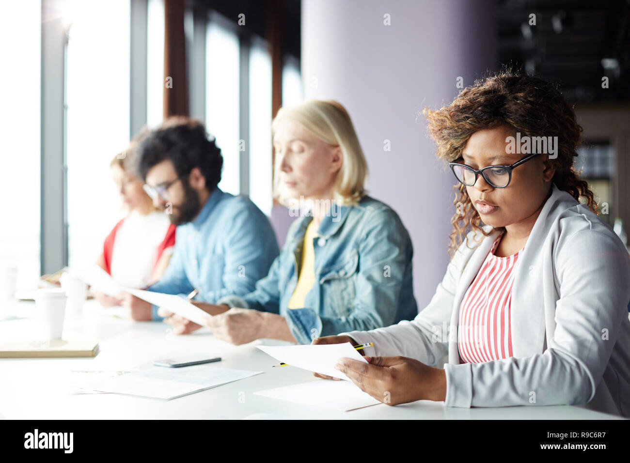 Co-workers reading Stock Photo
