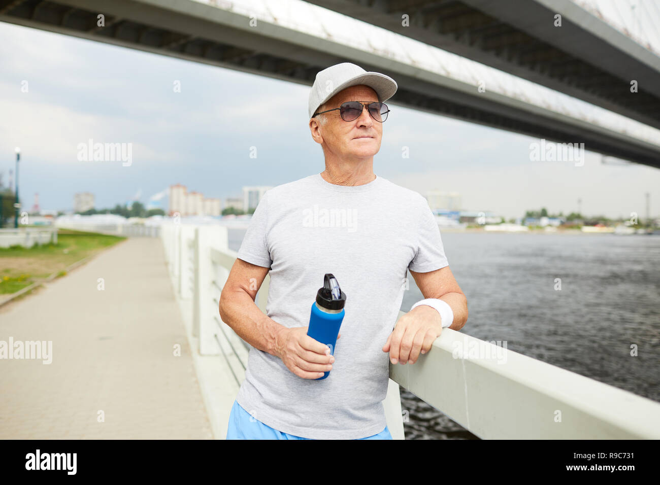 Sportsman with bottle of water Stock Photo - Alamy