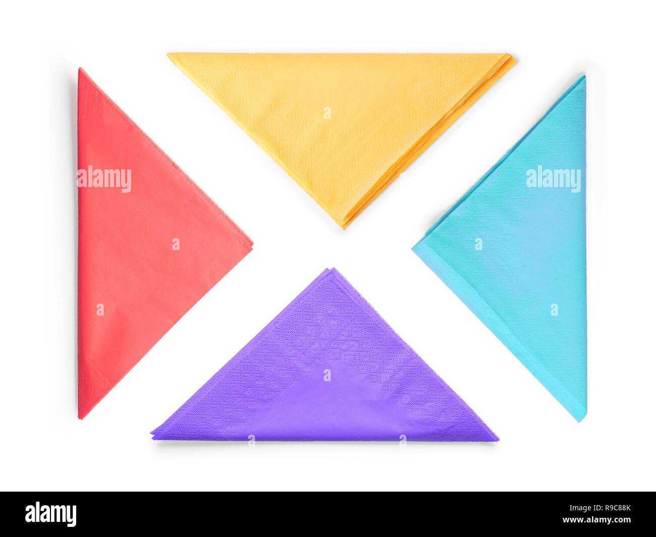 Colored paper napkins folded as triangle set. Isolated on white