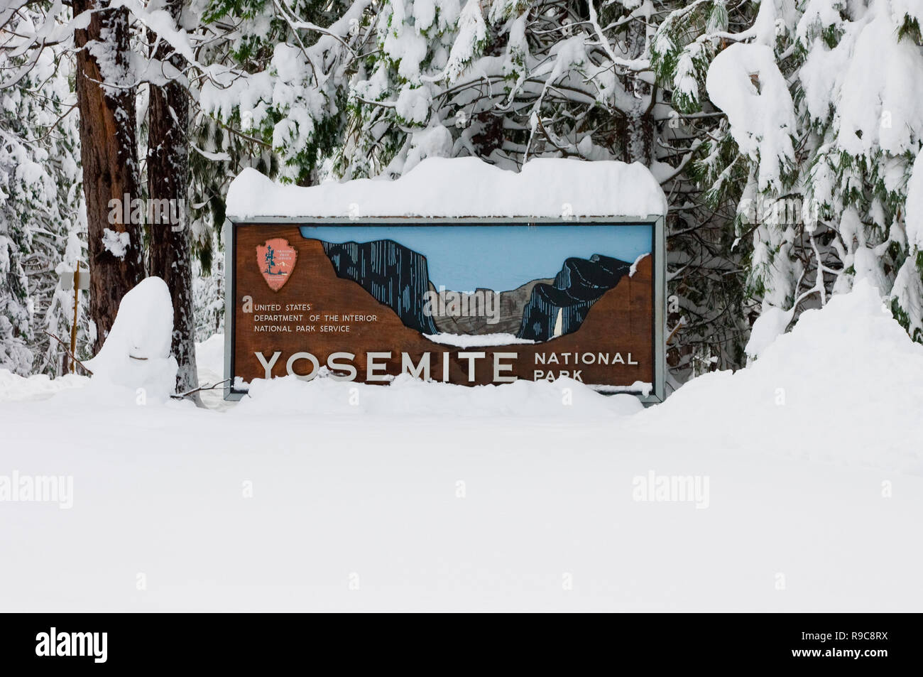 Yosemite entrance sign in winter with lots of snow Stock Photo