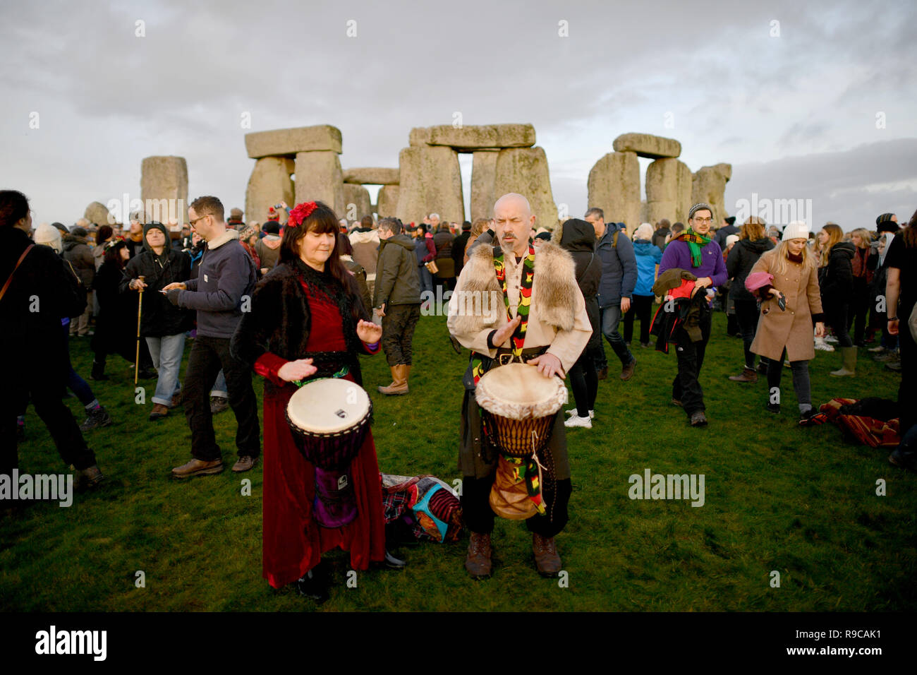 Drummers play as people gather at Stonehenge in Wiltshire to mark the ...