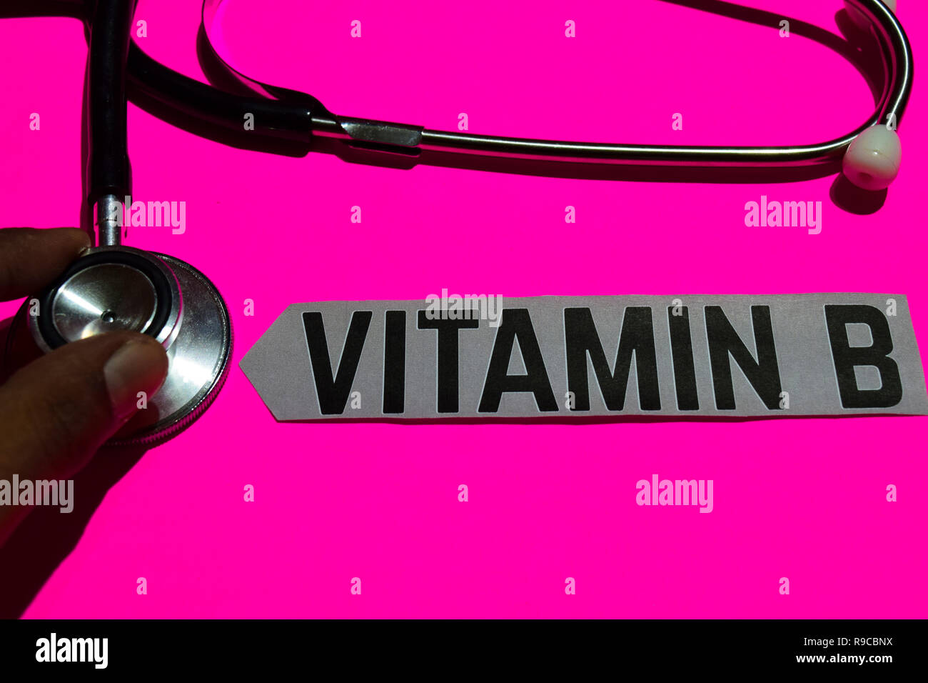 Vitamin B on the paper with healthcare concept. With stethoscope on pink bakcground Stock Photo
