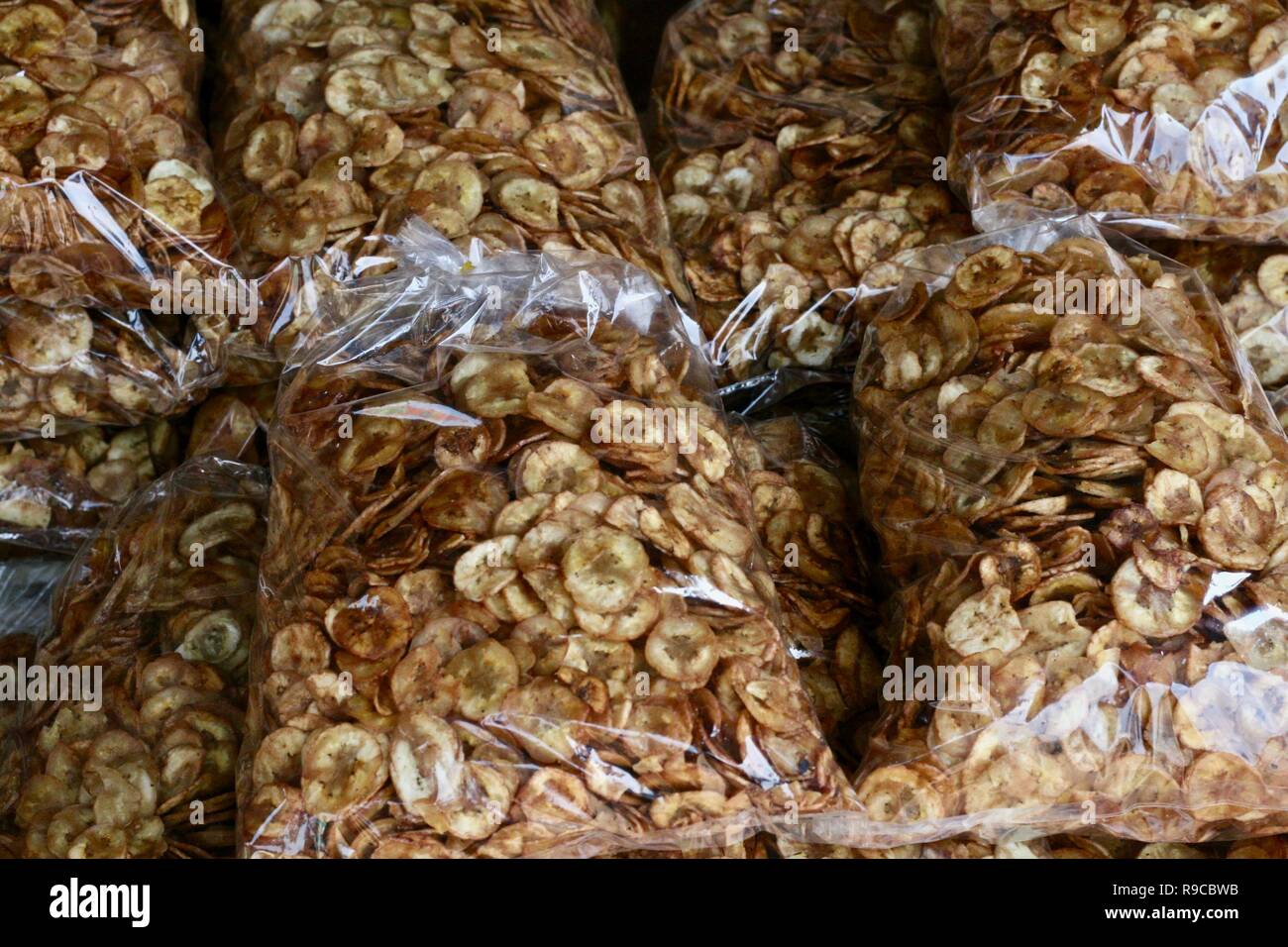 Bags of banana chips sold as street food snacks in Cambodia Stock Photo