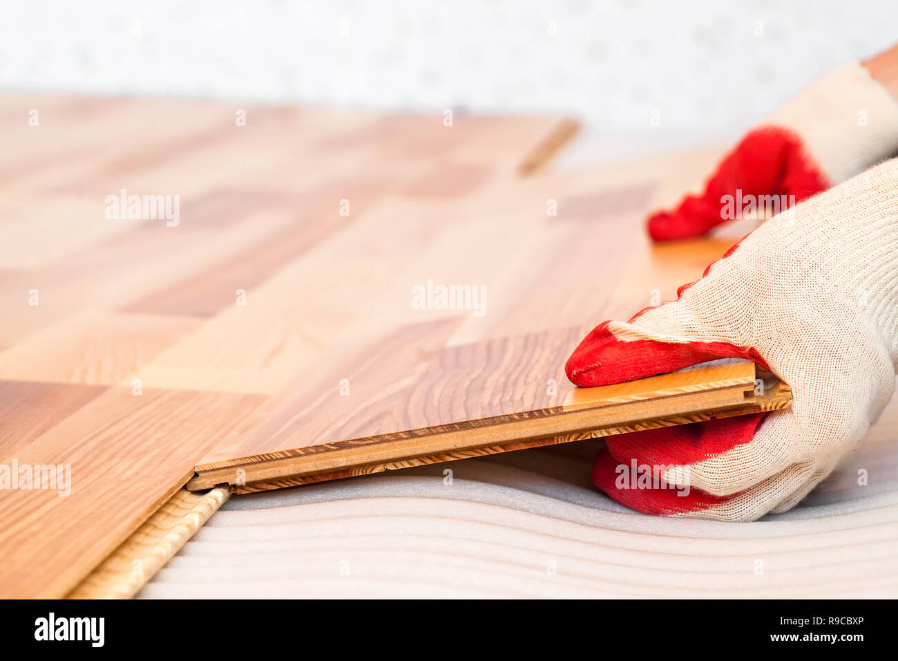 Installation of natural wood floorboard with ashtree veneer Stock Photo Alamy