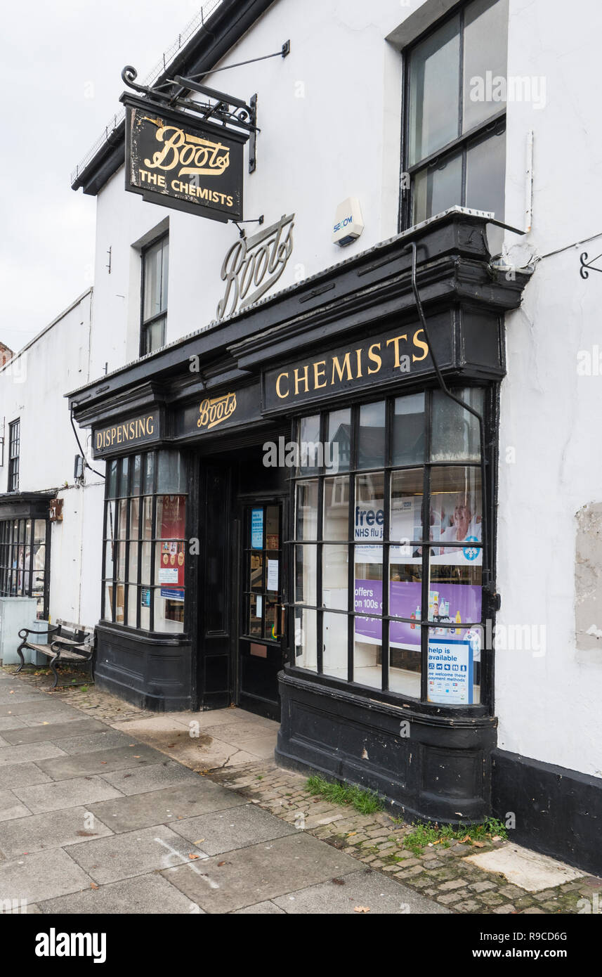 Old fashioned look Boots Dispensing Chemist shop front in Midhurst, West Sussex, England, UK. Boot Chemists. Stock Photo