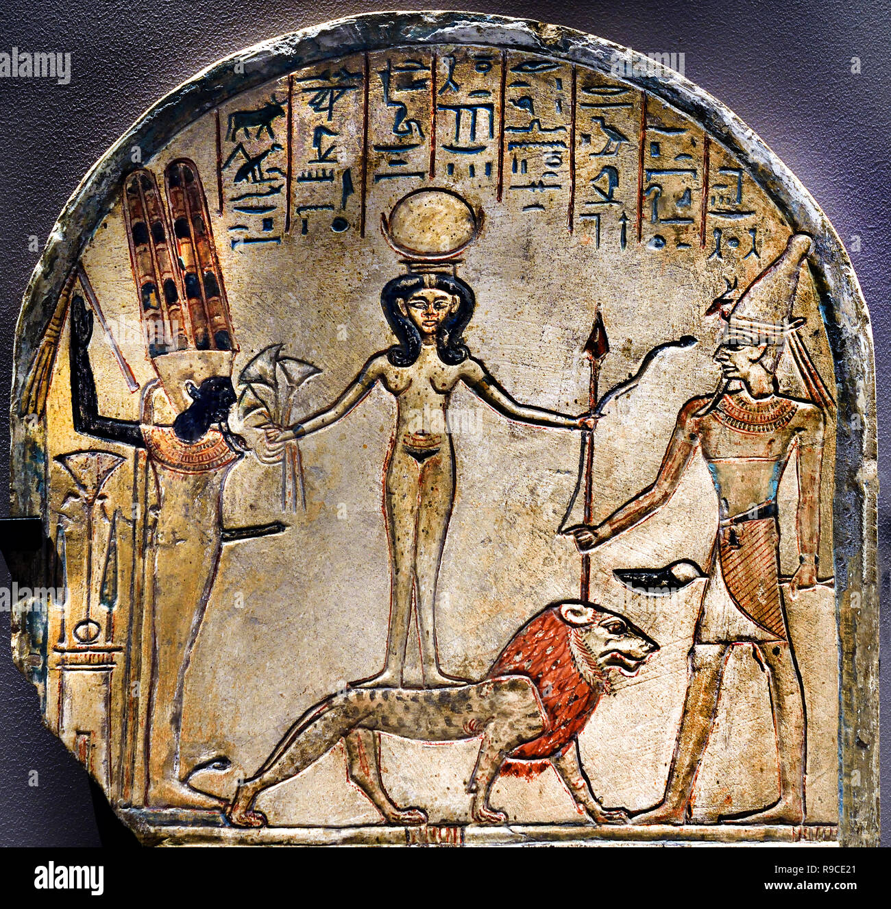 stele-of-qetesh-kadesh-from-deir-el-medina-19th-dynasty-1292-1191-bc-egypt-egyptian-qetesh-is-represented-as-a-frontal-nude-standing-on-a-lion-often-between-min-of-egypt-and-the-canaanite-warrior-god-resheph-she-holds-a-snake-in-one-hand-and-a-bouquet-lotus-flowers-in-the-other-as-symbols-of-creation-R9CE21.jpg